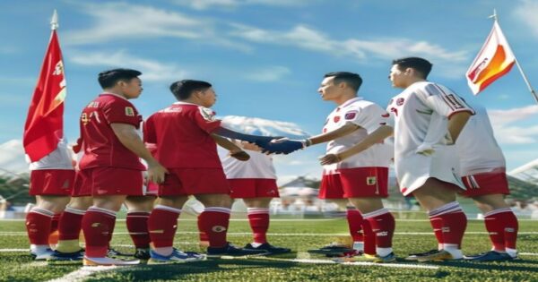 Fútbol y diplomacia: ¿nueva era de cooperación intercoreana? 2 A photorealistic image of a North Korean football team in red uniforms shaking hands with South Korean players in white uniforms on a football field, with flags of both countries in the background, un