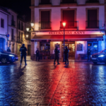 Photorealistic image of a police operation at night in a Spanish town square, with officers in tactical gear surrounding a restaurant, blue and red lights reflecting on wet pavement, no logos or text.